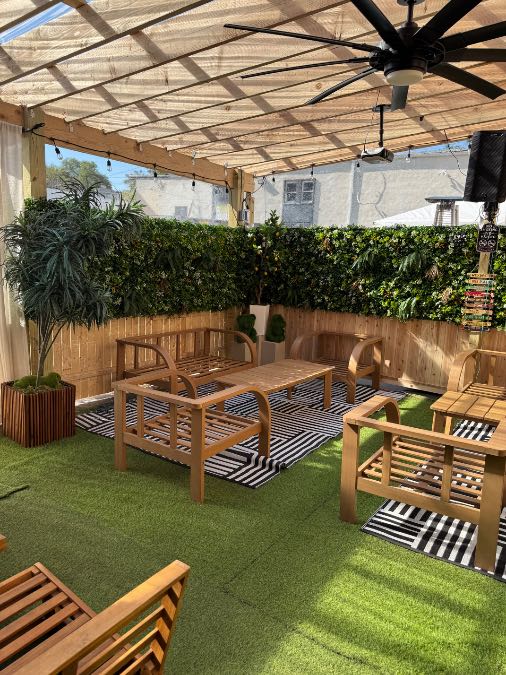 Covered outdoor lounge seating at The Patio